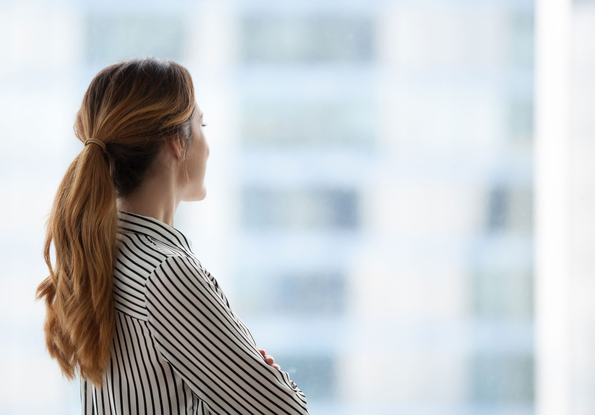 Woman looking out of a window